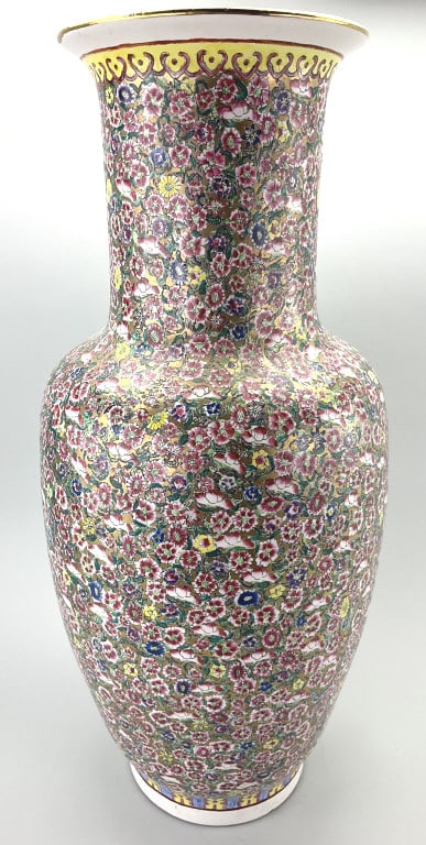 Large Chinese Famille Rose Porcelain Vase.: 24"Hx10"W. Millie-fleur polychrome decorated vase with bulbous body and flared upper rim. Spurious Qianlong four character mark on base. Condition: Good with a small vertical hairline on upper rim.**L