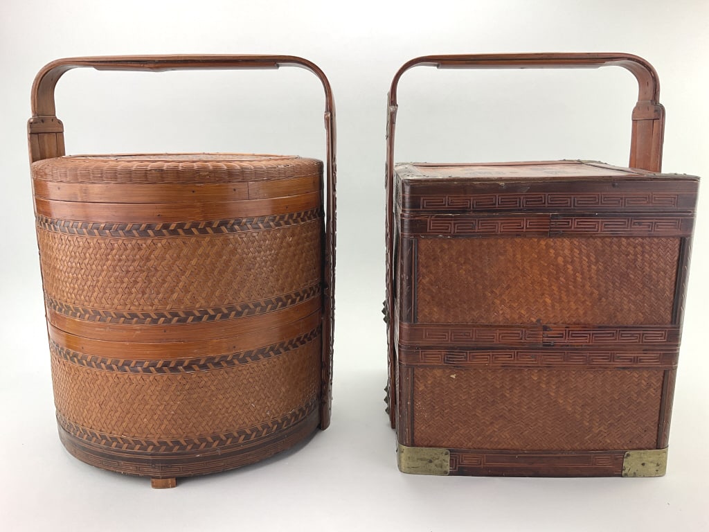 2 Antique Chinese Betrothal Baskets.: 16"Hx11-13"W. Circular and square body examples. Wedding or betrothal tiered baskets made of bamboo and rattan with carved bentwood handles. Square basket has brass mountings. Condition: Very good wit