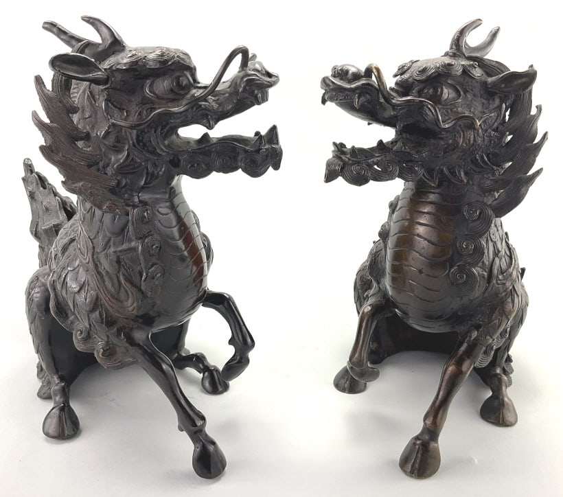 Pair of Japanese Bronze Qilin/Xiezhi Statues.: 13"x6"W. Unsigned, likely Japanese Meiji era (1868-1912). Finely detailed scaly mythical beasts. Condition: Very good with pleasing patina. **LOCAL PICKUP MUST BE BY APPT ONLY POSTAUCTION ONLY ON SPEC