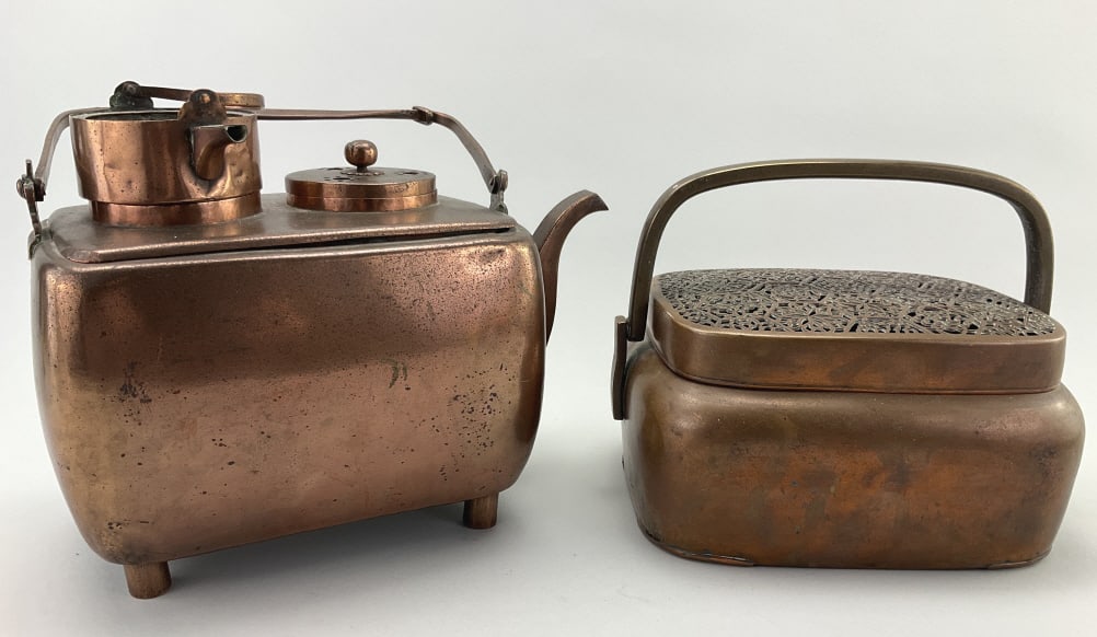Antique Japanese Copper Sake & Hand Warmers.: 11"Wx11.25"H. 19th century sake warmer with iron iron swing handle, bird-head spout and tubular feet. 19th century hand warmer with brass swing handle and hexagon filigree grate. Condition: Good with 