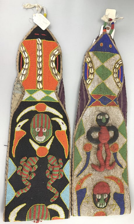 2 African Yoruba Beaded Diviner Sashes.: 64"L. West Africa, Nigeria, Yoruba culture, circa early to mid-20th century. Two ornate sashes made from cotton cloth and covered with thousands of glass seed beads and cowrie shells to form colorful 