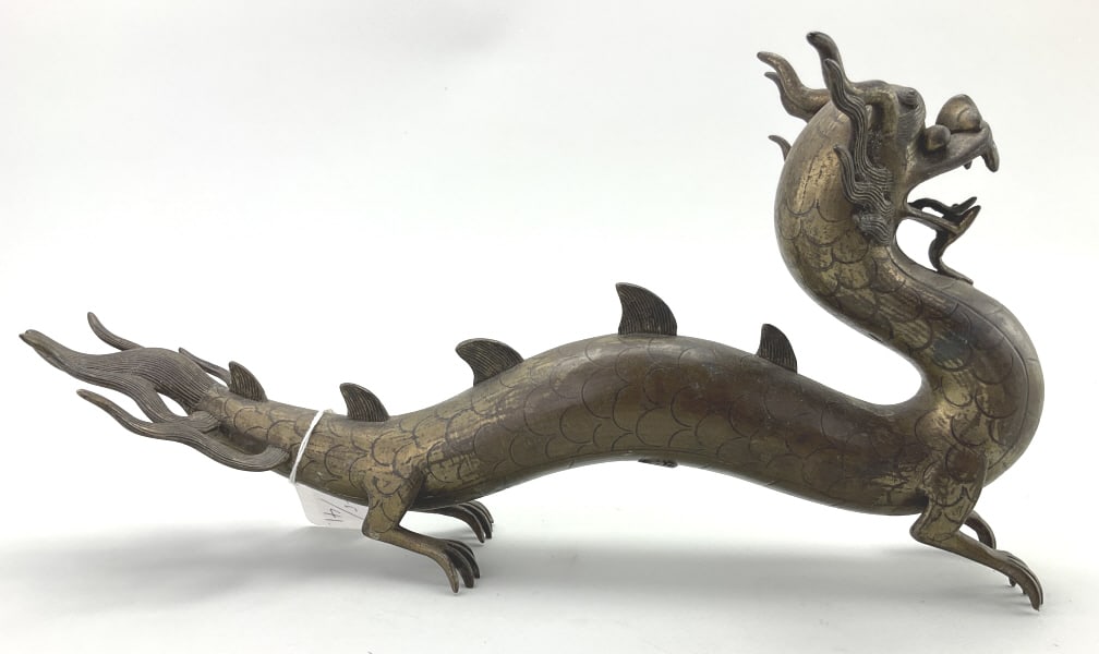 Chinese Bronze Feng Shui Dragon Sculpture.: 13.5"Dx3.5"W. Sculpture depicts a sinuous dragon in a dynamic pose. In Chinese culture, dragons symbolize power, strength, and good luck. Condition: Good with a small crack. **LOCAL PICKUP MUST BE BY 