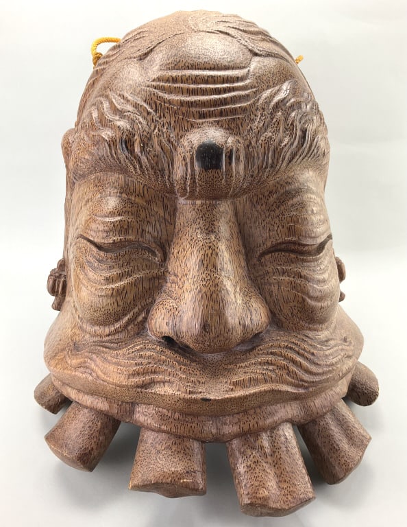 Vintage Balinese Hand Carved Okokan Head Bell.: Measures approximately 17 inches high x 18 inches wide. Vintage Balinese hand carved Wood folk art grotesque Okokan head large bell. Condition: Very good. **LOCAL PICKUP MUST BE BY APPT ONLY POSTAUCTI