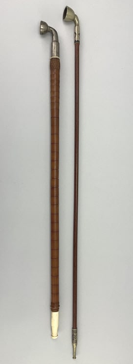 2 Antique Chinese Opium Pipes.: Longest piece measures 24 inches long. Qing dynasty 19th century. white brass bowls with wood shafts, one with carved bone mouthpiece and one with white brass mouthpiece having Chinese characters and 