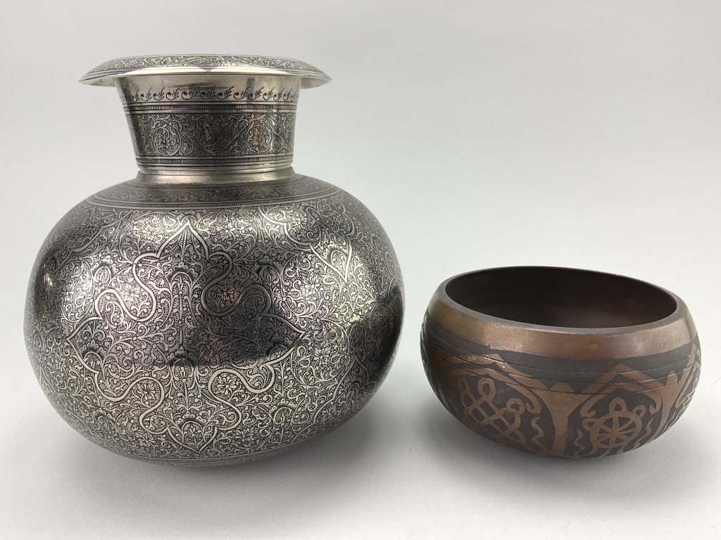 India Kalasha Pot & Tibetan Singing Bowl.: Vase measures approximately 8 inches high by 7 inches at its widest point. India silver-plated brass kalasha pot. Intricate hand-chased floral and arabesque designs. Tibetan mixed-brass singing bowl c
