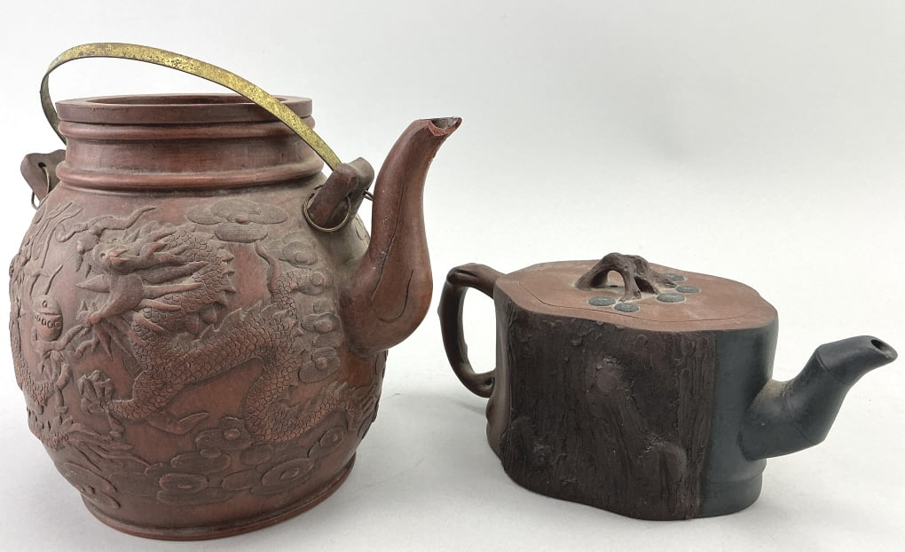 Two Chinese Yixing Zisha Clay Teapots.: Larger piece measures 6 inches high by 7 inches at its widest point. 1st: Unglazed hand-carved dragon design. 2nd: two-tone with bamboo and blossom motif. Yixing, Jiangsu Province, China, it's a uniqu