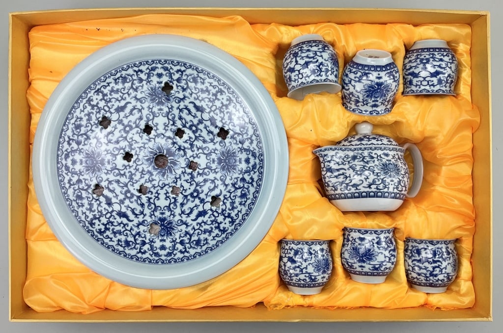 10pc Chinese Blue & White Porcelain Tea Set.: Gift box measures 21.5 inches long by 14 inches wide. Modern 20th century Chinese 4-character mark (Jing Zhen Cal De) city of Jingdezhen known as the porcelain capital. Blue and white lotus flower, fo