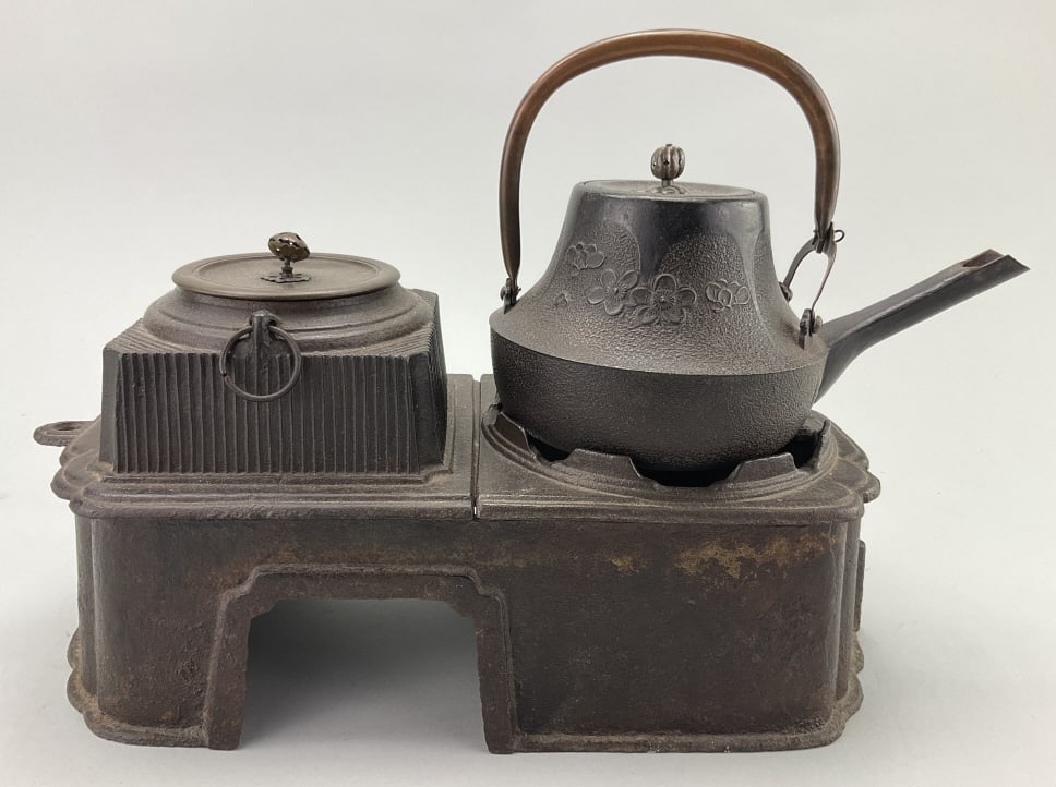 Antique Japanese Cast Iron Brazier Set.: Base measures approximately 14 inches long by 6.5 inches wide. Hibachi (brazier) with 2 tetsubin (iron kettle) and often have a bumpy texture which is called arare (hailstone) in Japanese. Condition: 