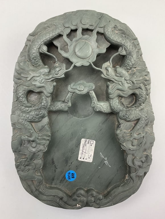 Antique Chinese Soapstone Carved Dragon Ink stone.: Measures 13 inches long by 10 inches wide. Late Qing Dynasty. Finely carved jade green soapstone with opposing dragons competing over a flaming pearl amongst the clouds. Condition: Good with light wea