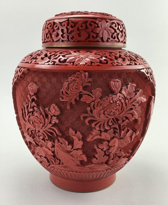 Vintage Chinese Carved Cinnabar Ginger Jar.: Measures approximately 9.5 inches high by approximately 7 inches wide. Interior with blue enameled brass and exterior carved cinnabar with Chinese Famille Rose, leiwen thunder and cloud pattern along 