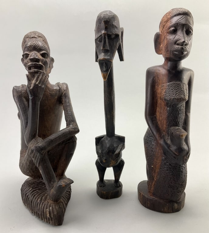 Vintage African Carved Wooden Tribal Figures.: Measure 11.5-12.5 inches high. Makonde East African Thinking Man. Baule or Maasai long-neck warrior. Baule tribe female figure from the Ivory Coast. Condition: Good with wear.**LOCAL PICKUP MUST BE BY