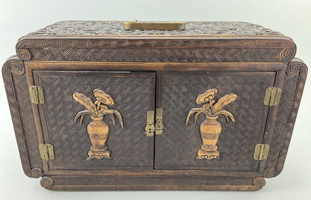 Chinese Hand Carved Traveling Seal Chest.: Measures 16.5 inches by 7.5 inches. Late Qing Dynasty/Republic period. Carved hardwood with competing bats on lid and vases with lotus flowers on doors. Interior with a central compartment flanked by 