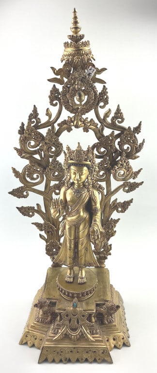 Antique Nepali Maitreya Gilt Bronze Buddha Statue.: Measures 30 inches high. Standing deity representing Maitreya, the Buddha of the Future. Fire-gilt bronze with foliate and scroll openwork backdrop (aureole) and stepped platform base set with a singl