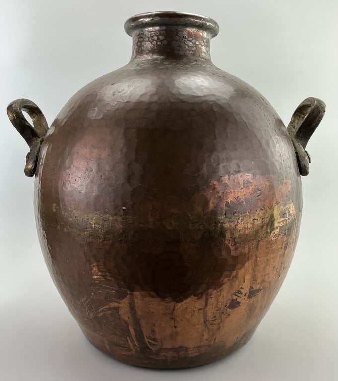 Antique Egyptian Hand-Hammered Copper Bean Pot.: Measures 19 inches high by 17 inches wide. 19th century with rolled spout rim, bulbous body and riveted brass stirrup handles. Condition: Good with minor dents and wear. **LOCAL PICKUP MUST BE BY APPT