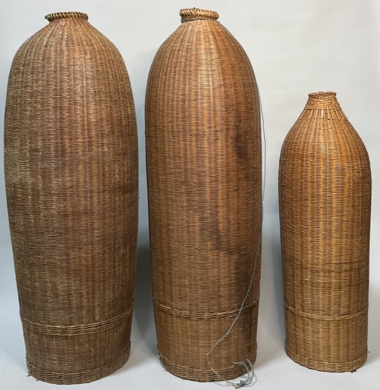 3 Vintage South Asia Roshni Baskets.: Largest basket measures 33 inches high by approximately 8.5 inches wide. 3 woven sea grass and rattan floor vase baskets. Condition: 2 are good, 1 has separation at mouth.**LOCAL PICKUP MUST BE BY APP