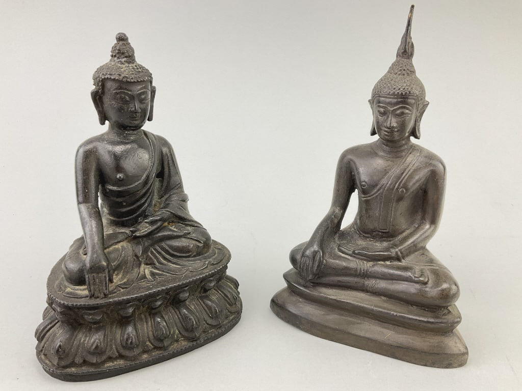 2 Antique Thai Bronze Buddha Figures.: Measure approximately 7.5 inches high. 1st: Shakyamuni Buddha seated in the Dhyana mudra position with lotus base. 2nd: Seated figure of Buddha Maravijaya. Condition: Good with minor wear, pleasing pa