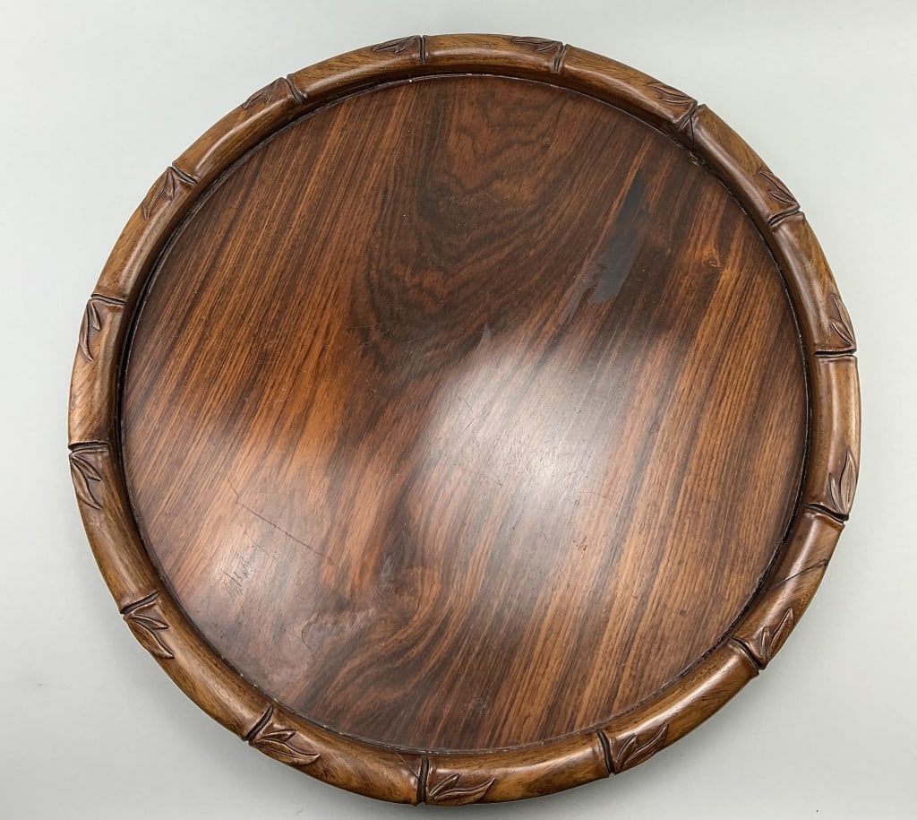 Chinese Qing Dynasty Huanghuali Wood Tray.: Measures 19 inches in diameter. Heavy circular serving tray with carved bamboo and lattice rim and sides. Condition: Very good. **LOCAL PICKUP MUST BE BY APPT ONLY POST AUCTION ONLY ON SPECIFIC DATES:
