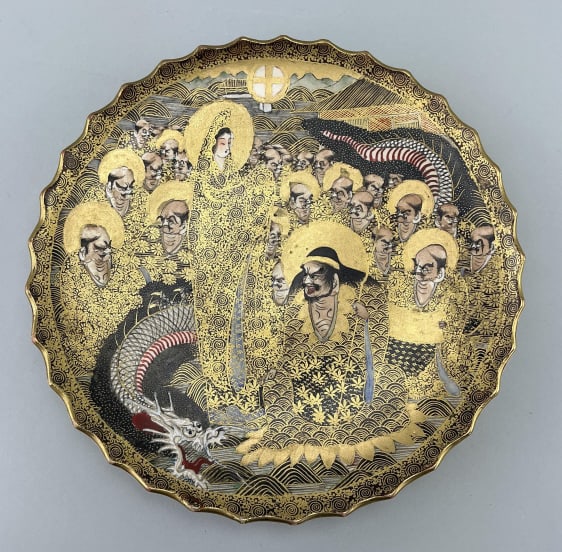 Japanese Meiji Period Satsuma Pottery Plate.: Measures 9 inches in diameter. Satsuma Province in Southern Kyushu. Scalloped edge and signed on verso by the artist. Elaborate decoration features design of Rakan (Buddhist figures) and a dragon on a