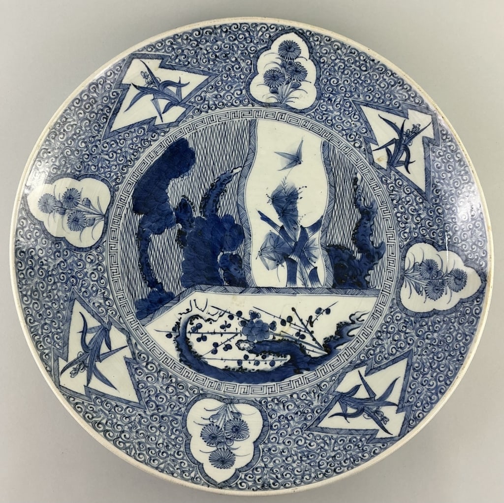 Antique Chinese Blue & White Porcelain Charger.: Measures 18 inches in diameter. Likely Qing dynasty (1644-1911). Central panel with landscape and alternating foliate cartouches on border. Blue under-glaze single character mark. Condition: Very good