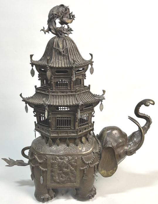 Japanese Meiji Period Bronze Elephant Censer.: 20 inches long x 7 inches wide x 25 inches tall. East Asia, Japan, Meiji Era (1868-1912). An elaborate gilt-bronze incense burner crafted in three sections: a hollow elephant vessel, and a two-tieredp