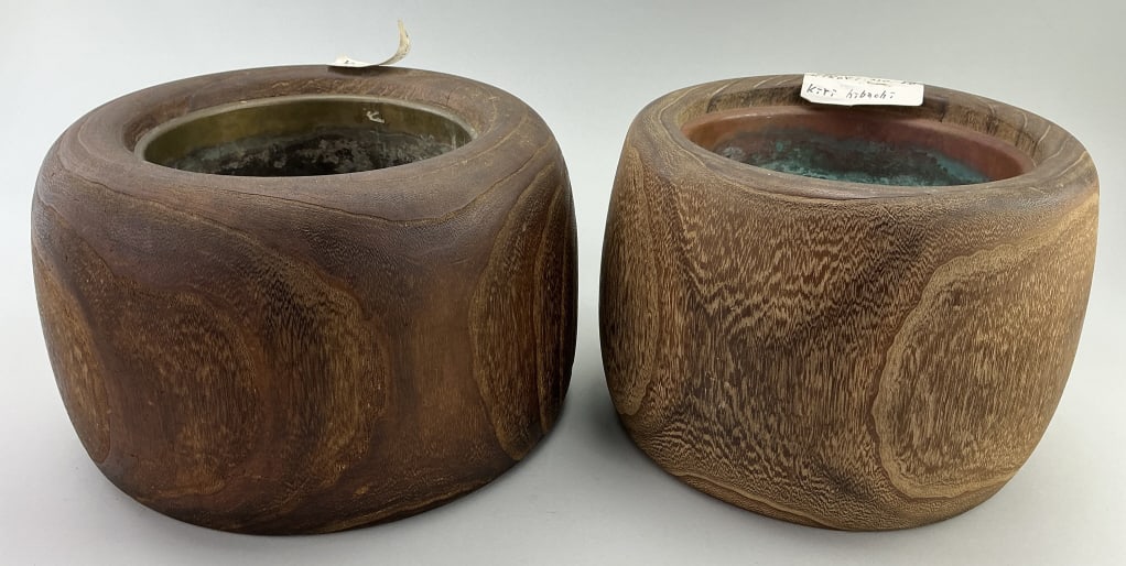 2 Antique Japanese Kiri Wood Hibachi Braziers.: Measure 8 inches high by 12 inches wide. East Asia, Japan, likely Meiji period (1868-1912), beautifully grained turned wood hibachi brazier, crafted from paulownia (kiri wood), with the original coppe