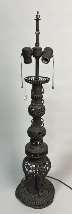 Japanese Meiji Period Cast Iron Lamp.: Measures 7.5 inches across base x 32 inches tall. With tripod feet and openwork balls on pedestal stems, stylized cloud motif. Carved white jadeite finial. Mounted (electrified) as a lamp. Condition: 