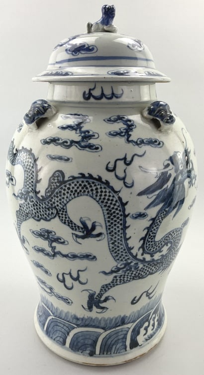 Antique Chinese Twin Dragon Porcelain Ginger Jar.: Measures 18 inches high. Unsigned, likely Meiji period (1868-1912), decorated blue and white porcelain featuring twin dragons chasing a flaming pearl amongst the clouds. Baluster-form body with applie
