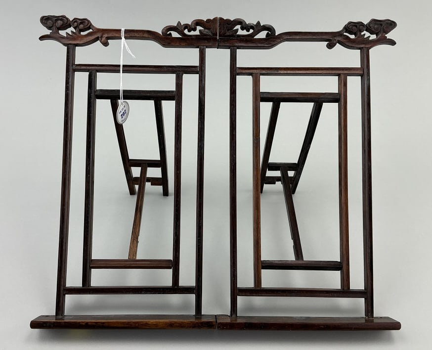 Antique Chinese Carved Rosewood Table-Top Easel.: Measures approximately 13.25 inches wide by 12 inches high. Meiji period (1868-1912). Carved frame with adjustable double supports. Likely was made as a calligraphy stand. Condition: Good with minor w