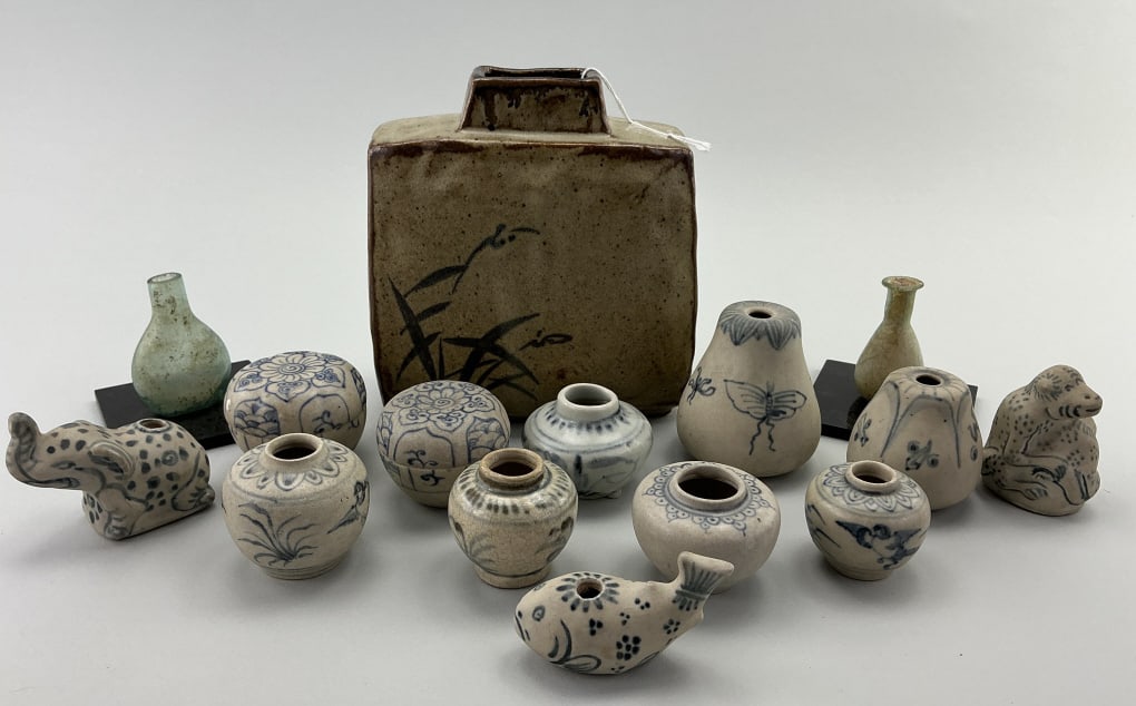 Miniature Asian Ceramics, Vessels, and Pottery.: Largest piece measures 6.5 inches high. Variety of Annamese blue and white jarlets. Early blown glass miniature vessels, and a vintage Japanese square stoneware vase. Condition: Good, no damage.**LOCA