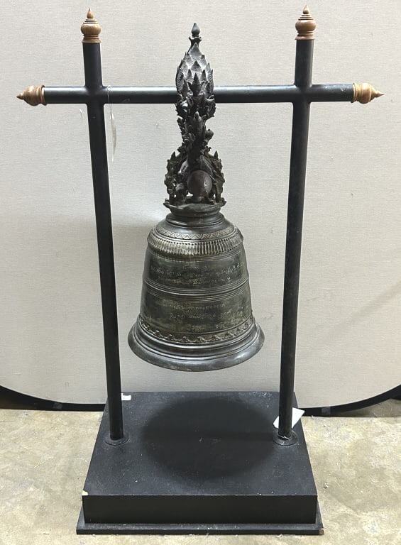 Antique Burmese Bronze Buddhist Temple Bell.: Bell measures 15.5 inches wide x 23.5 inches tall. Stand measures 27 inches wide x 53 inches tall. Support mounts are attached above a stylized lotus design appearing on the bell's shoulder, in the fo