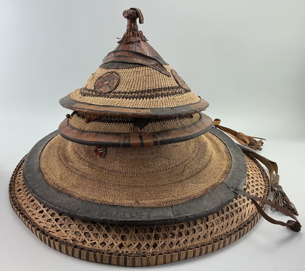 West African Fulani Leather and Plant Fiber Hats.: Largest piece measures 28 inches in diameter. Various size and style West African Fulani hats. Made of leather, veta vera grass and straw. Condition: Good with wear. **LOCAL PICKUP MUST BE BY APPT ONL