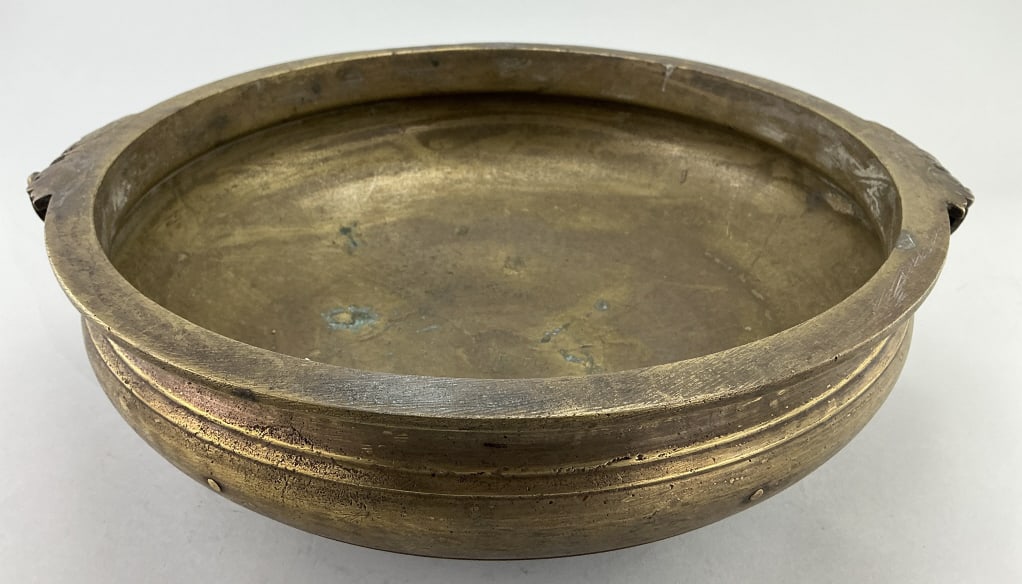 Antique India Bronze Urli Bowl.: Measures 18 inches wide and 5 inches high. These traditional bowls were used in Indian culture for rituals and festivals, for cooking large quantities of food, for preparing Ayurvedic medicines, or fo