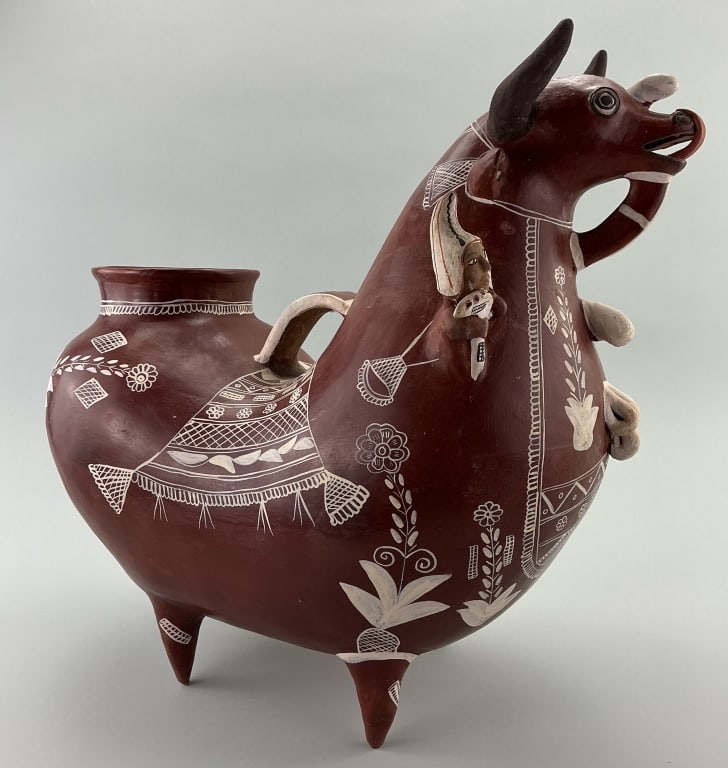 Peruvian Folk Art Terracotta Bull Vessel.: Measures 17 inches high. Period style vessel are known as Torito de Pucara, traditional pottery from the Quinoa region of the Andes. It is a form of an askos, a type of ancient vessel for holding liqu