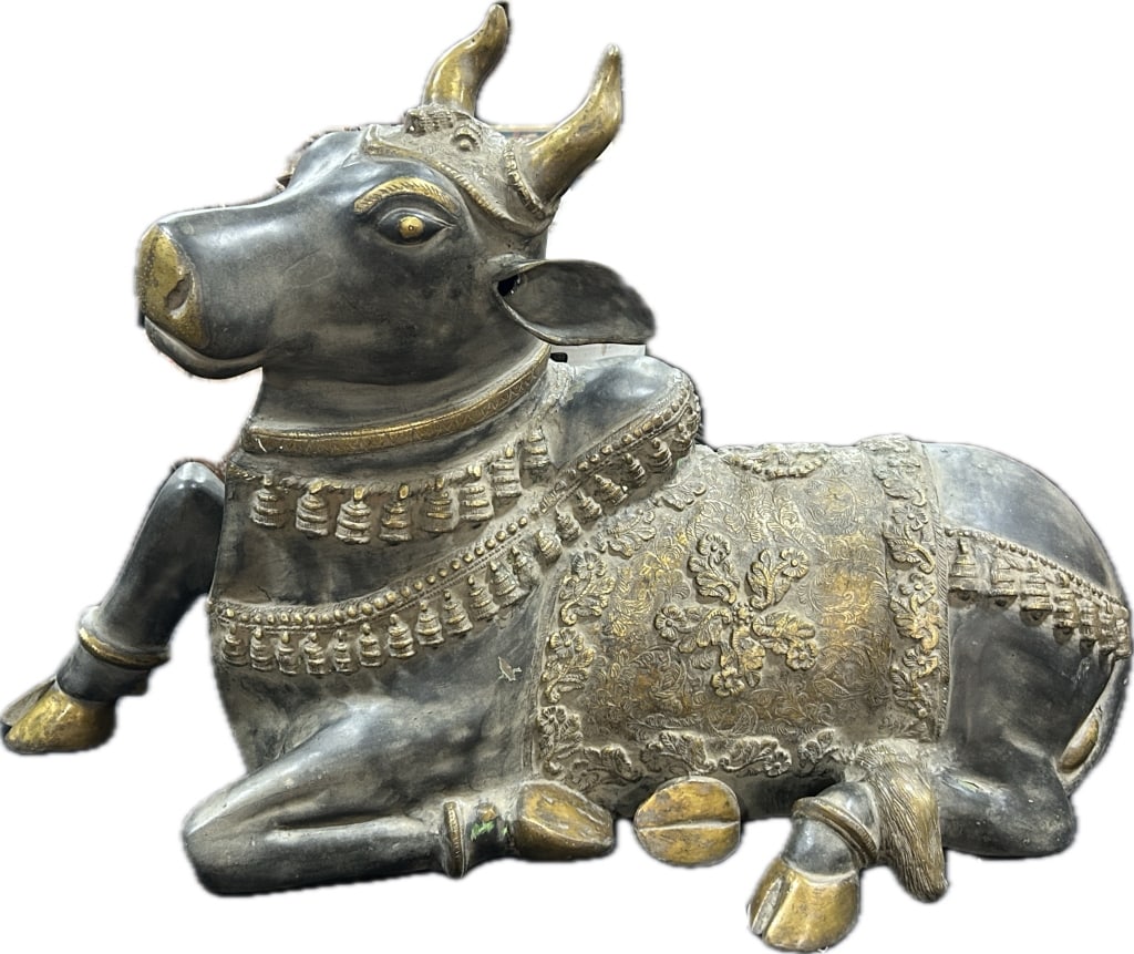 Vintage India Brass Nandi Bull Statue.: Measures 3 feet from snout to tail and 13 inches wide. Reclining figure of Nandi bull with pewter washed and gilt finish. Cast in sections. Nandi, the sacred bull, is the primary vehicle (vahana), gat