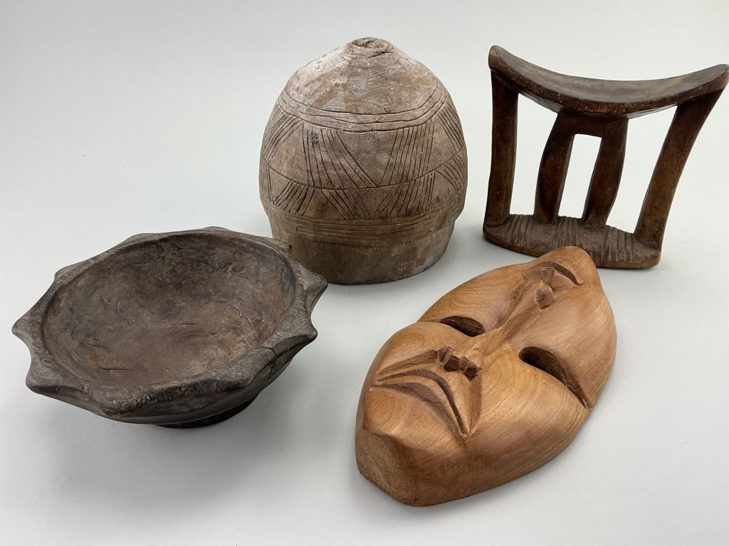 African & Filipino Tribal & Ceremonial Artifacts.: Headrest measures 7 inches high. Hand-carved hardwood Ifugao ceremonial bowl known as a duyu, from the northern Luzon Island in the Philippines. African Nupe pottery storage pot with incised decoratio