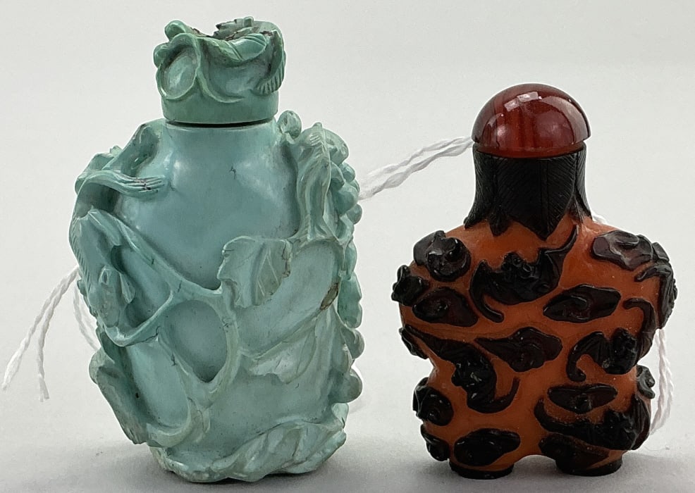 Chinese Turquoise & Peking Glass Snuff Bottles.: Measure 2 and 2.5 inches high. 1st: High-relief carved turquoise squirrel and grapes snuff bottle. 2nd: Peking glass bats in clouds snuff bottle with unusual orange ground with purple overlay. Conditi