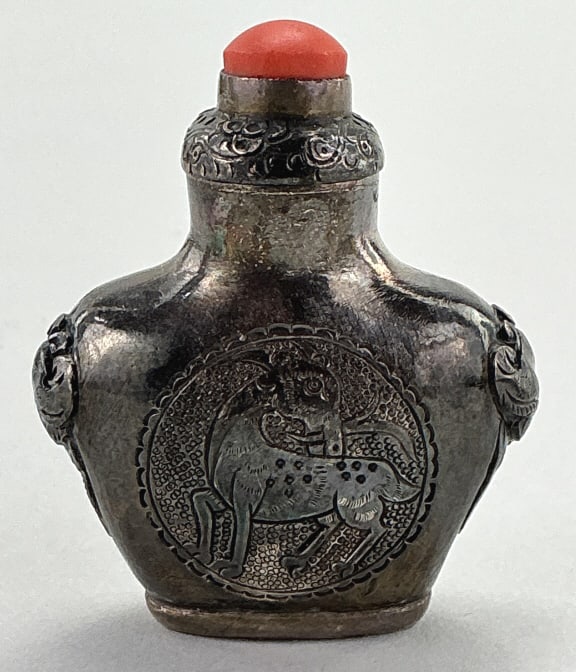 Antique Chinese/ Mongolian Silver Snuff Bottle.: Measures 2 inches high. Spade-form with phoenix and deer cartouches and mask ring handles with coral stopper. Seal mark on bottom. Condition: Good, no damage, tarnished.**LOCAL PICKUP MUST BE BY APPT 