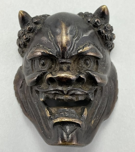 Japanese Bronze Mask of Demon Hannya Netsuke.: Measures 2 inches high. Unsigned 19th century Japanese bronze netsuke representing a theatrical mask of Demon Hannya. Condition: Good with dark patina. **LOCAL PICKUP MUST BE BY APPT ONLY POSTAUCTION 