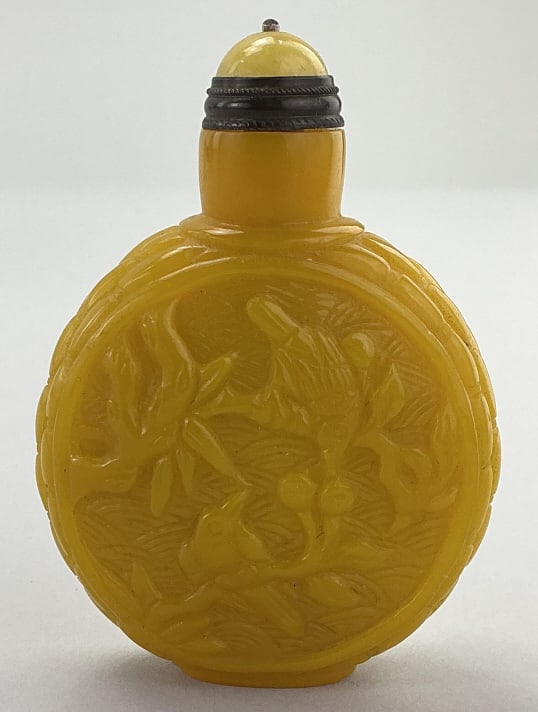 Antique Chinese Peking Glass Snuff Bottle.: Measures 3 inches high. Unsigned, likely Qing Dynasty Late 19th/early 20th century. Finely carved with discordal body, Imperial yellow Peking glass bottle depicting birds in budding and flowering tree