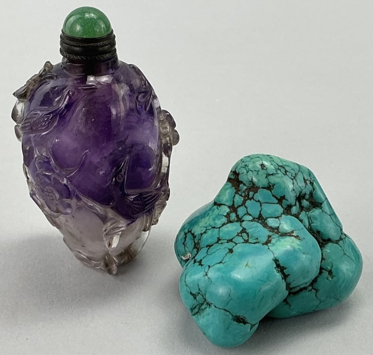 Chinese Carved Amethyst & Turquoise Snuff Bottles.: Measure 2 to 2.5 inches high. 1st: Amethyst deeply carved body features plum blossoms and buds, with jade stopper. 2nd. Natural turquoise nugget bottle. Condition: Very good, turquoise bottle is missi