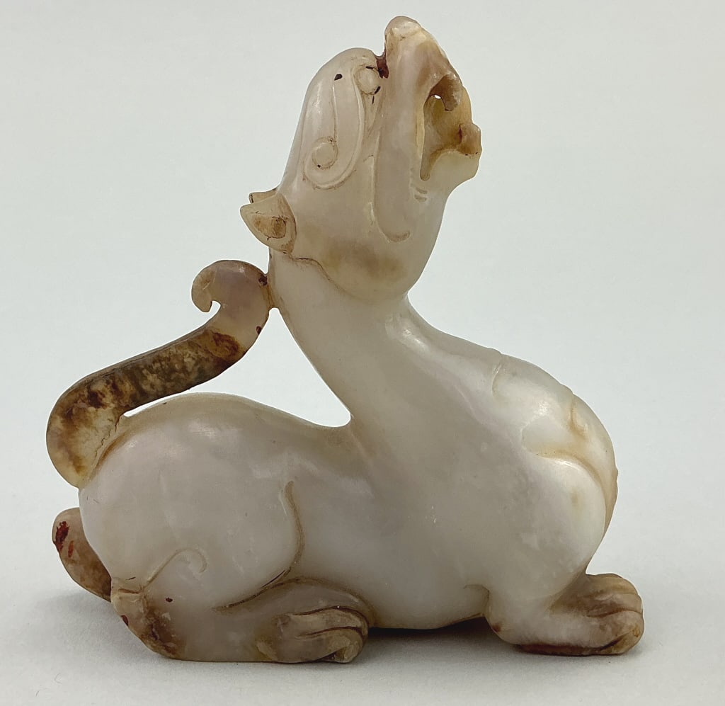 Chinese Nephrite Jade Auspicious Beast Carving.: Measures 4.5 inches wide. Chinese Qing Dynasty natural carved Hetian nephrite jade fortune beast statue. Condition: Good with minor wear and tiny chips. **LOCAL PICKUP MUST BE BY APPT ONLY POSTAUCTION
