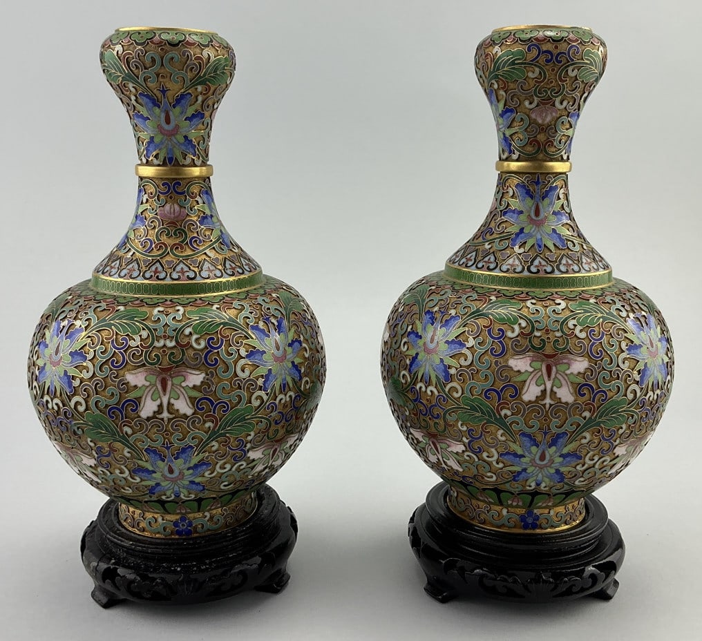 Pair of Chinese Cloisonné Enamel Vases.: Measure 9.5 inches high. Antique champleve orchid flower pattern garlic button vases on wooden stands. Circa 1920s. Condition: Very good. **LOCAL PICKUP MUST BE BY APPT ONLY POSTAUCTION ONLY ON SPECIF