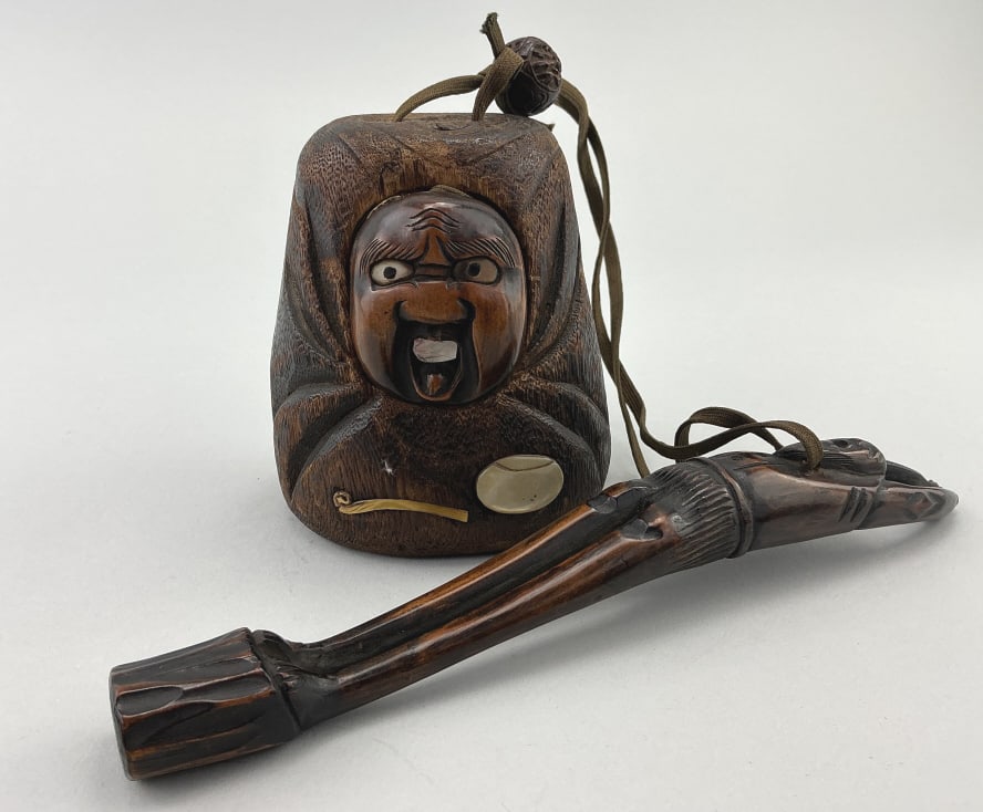 Antique Japanese Kiseru Smoking Set.: Pouch/box measures 4 inches high. Meiji era (1868-1912) Figural carved tabako-ire (case) with figural carved wood sheath. Condition: Good with wear, missing pipe. **LOCAL PICKUP MUST BE BY APPT ONLY P
