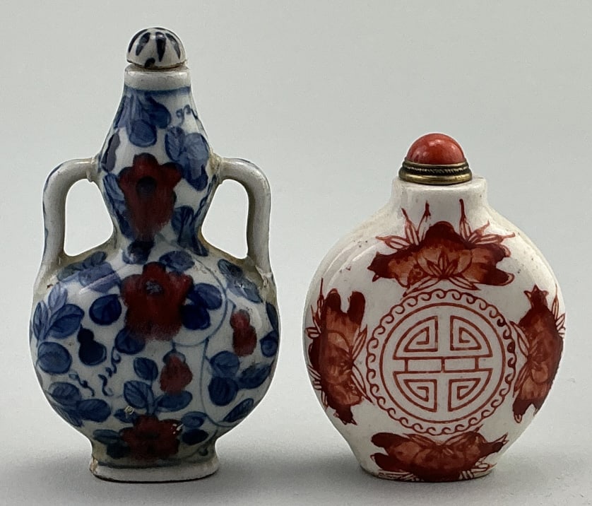 2 Antique Chinese Glazed Porcelain Snuff Bottles.: Measure 2.5 and 3 inches high. Both likely Qing dynasty (1644–1912).1st: Double gourd form with open handles, iron red flowers with cobalt blue foliate. 4 character mark on base. 2nd: Disc-form,