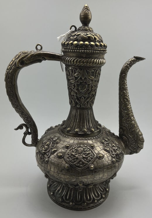 Antique Tibetan Silver Plated Brass Ewer.: Measures 14 inches high. Ceremonial ewer often referred to as a Surahi or Aftaba. Intricate repousse and engraved designs with serpent handle. Good with tarnish and wear. **LOCAL PICKUP MUST BE BY APP