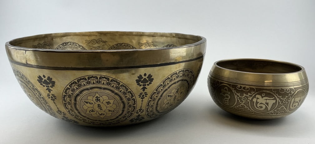 2 Tibetan Bronze Jambati Singing Bowls.: Largest bowl measures 12 inches in diameter. Both bowls having various traditional hand-etched designs. Used for meditation and sound healing practices. Condition: Very good.**LOCAL PICKUP MUST BE BY 
