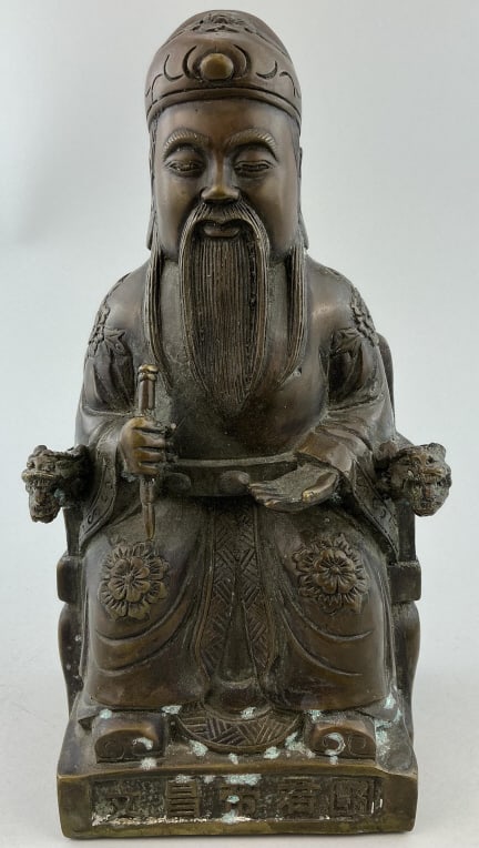 Antique Chinese Bronze Caishen Deity Statuette.: Measures 10 inches high. Caishen (God of Wealth) seated in throne, wearing a scholar's hat and robe, and holding a Ruyi scepter. Condition: Good with scattered corrosion. **LOCAL PICKUP MUST BE BY APP