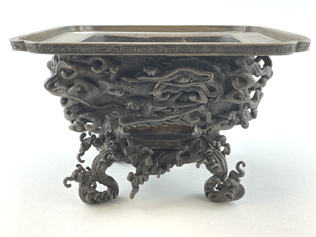 Japanese Edo Period Bronze Dragon Usabata.: Measures 4.5 inches high x 7" square. Japanese Bronze Usabata, early 19th century by Seiun. In square form with openwork wave-pattern base. Body with high-relief dragon and cloud design. Ex Collection