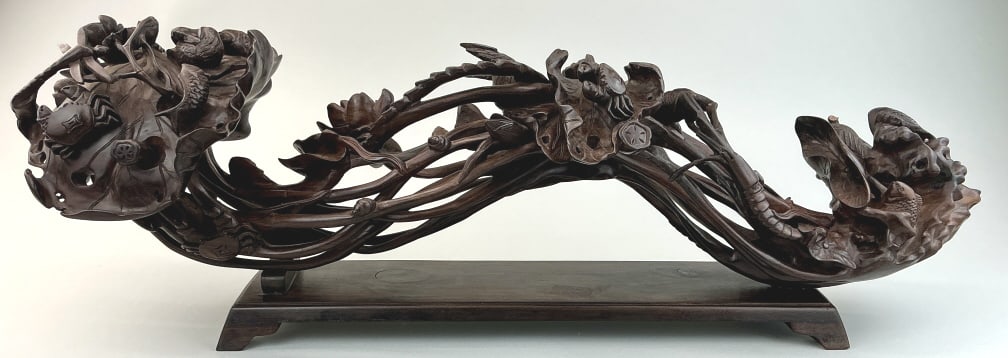 Elaborate Antique Chinese Yu-i Wood Carving.: Measures 28 inches long. Early 20th century. Profusely carved depicting frog, crayfish, crab, koi fish, dragonfly, birds, water lily, etc. With stand and case. Condition: Good with some loss and age c