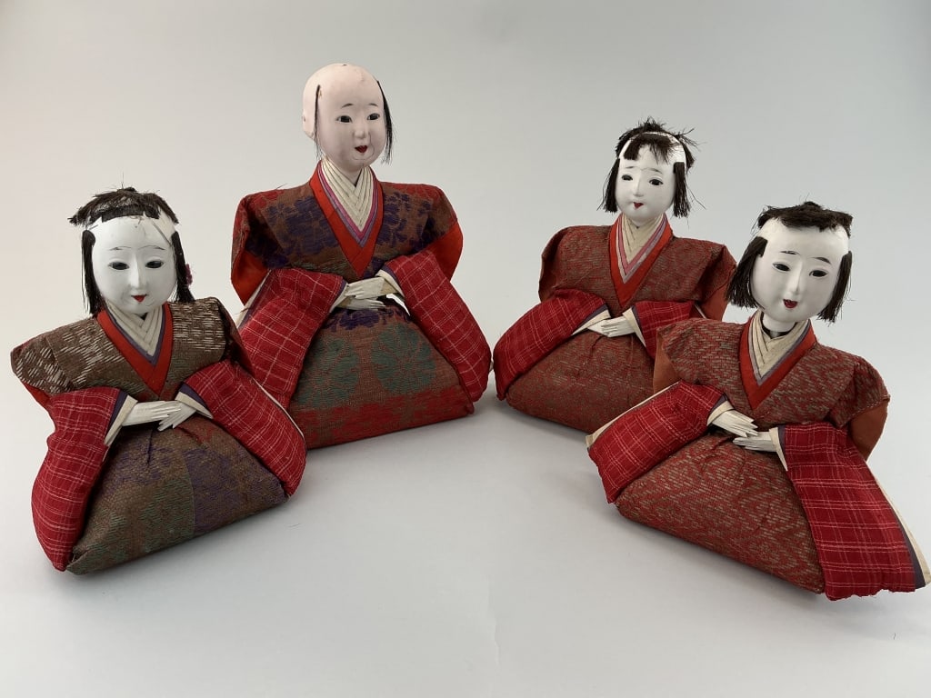 4 Antique Japanese Hina-ningyo Dolls.: Measure 7.5 to 9.5 inches high. Imperial dolls used in Bunraku (puppet theatre).Their white porcelain faces are made from gofun, a paste made from ground oyster shells and mixed with glue. They wear m